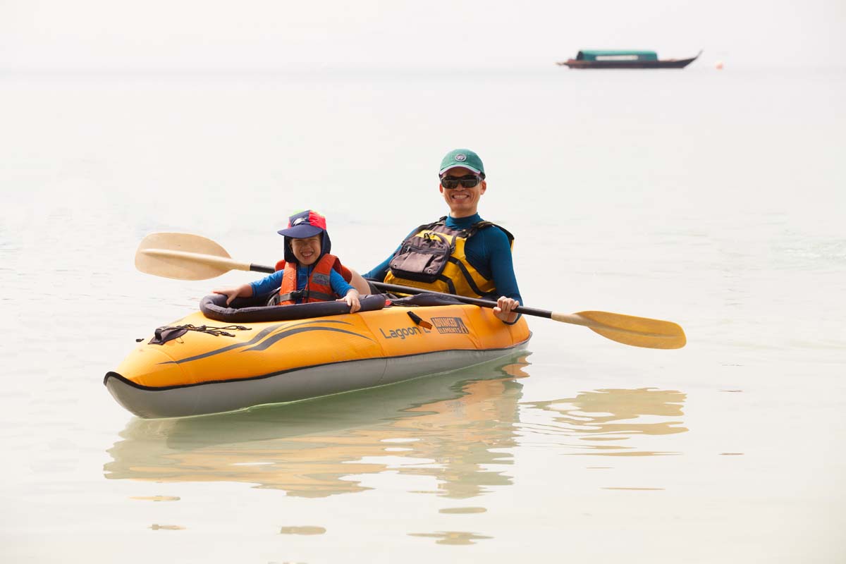 kayak dad and son telunas-beach-resort-activities_30741360327_o